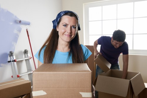 Local movers in Twickenham managing packed boxes and furniture