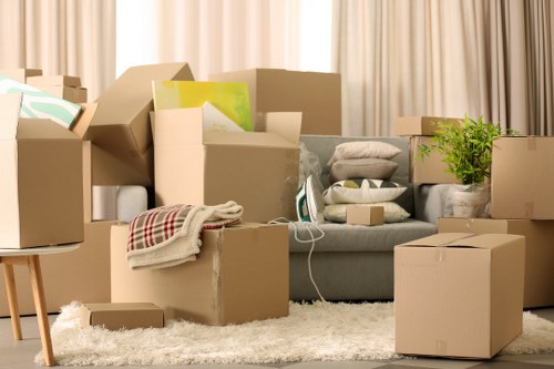 Local moving crew safely transporting furniture and boxes