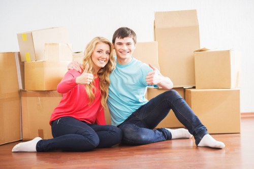 Removal team loading furniture and boxes during a home move