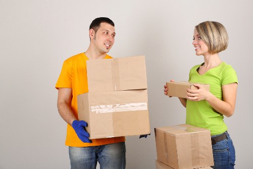 Professional movers carrying furniture during a house move in Twickenham