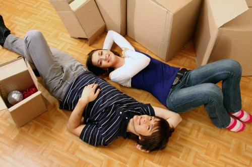 Packed boxes and furniture ready for removal truck hire