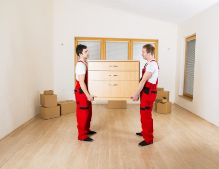 Packed boxes and furniture ready for removal in a Twickenham property