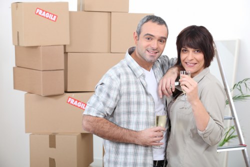 Professional movers assessing a property layout before lifting items